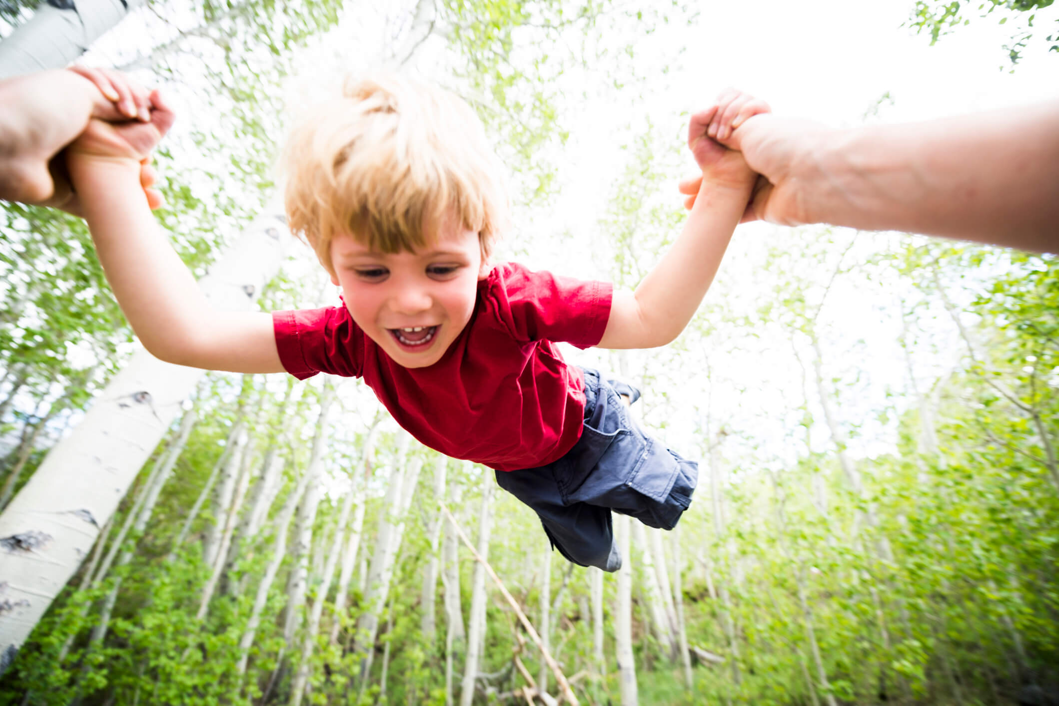 swinging toddler in Aspen trees